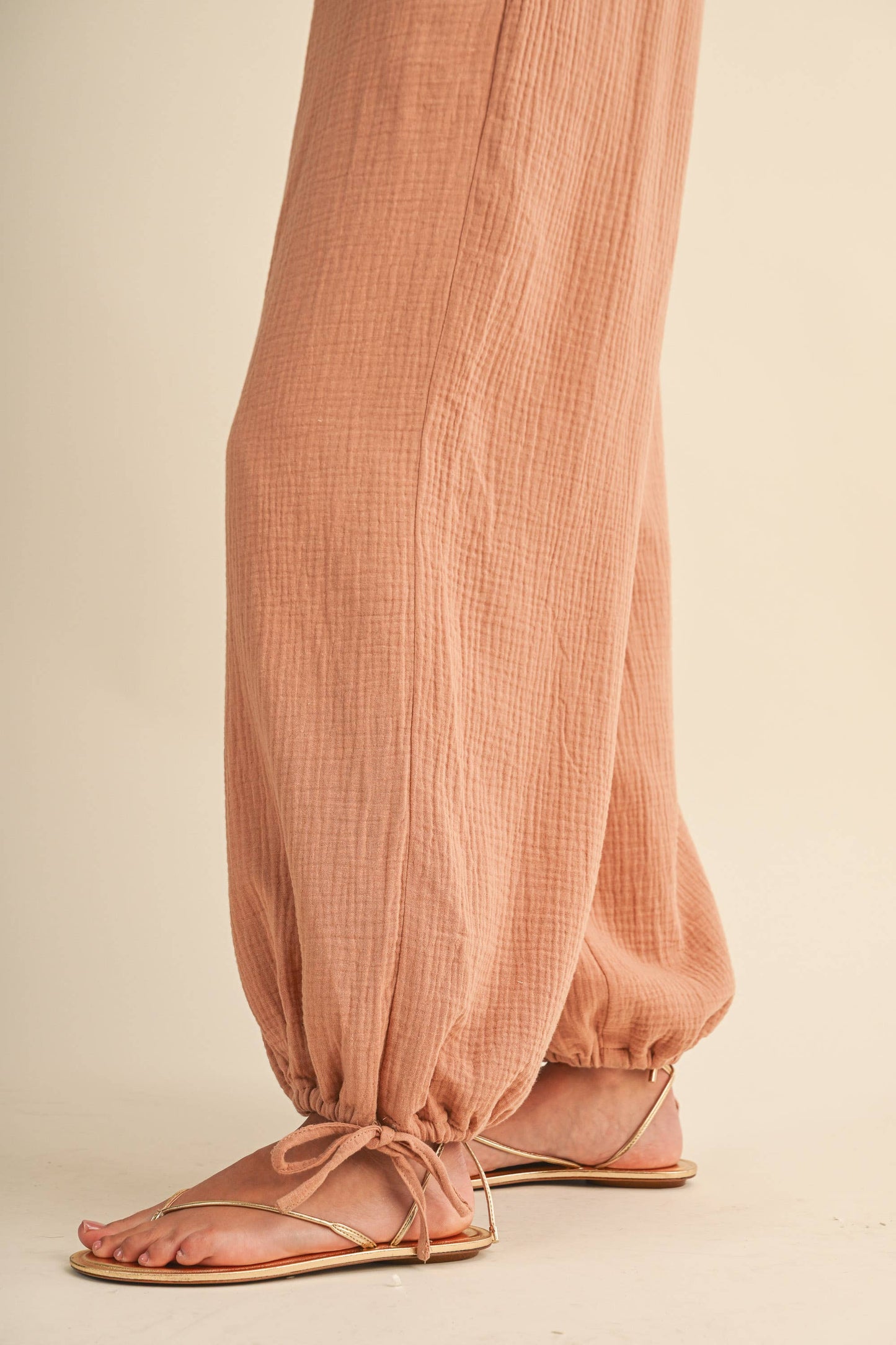 STRAPLESS SMOCKED CHEVRON WAIST ADJUSTABLE ANKLE JUMPSUIT